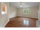 Open floor plan in living room with hardwood floors, fireplace, and natural light at 2422 Oak Dr, Clayton, IN 46118