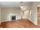 Bright living room showcasing fireplace, hardwood floors and vaulted ceilings at 2422 Oak Dr, Clayton, IN 46118