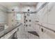 Walk-in shower featuring dual shower heads, mosaic tile, and a glass enclosure at 2422 Oak Dr, Clayton, IN 46118