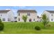 The house boasts a backyard with a fire pit and a large lawn at 2502 Creekland Dr, Columbus, IN 47201