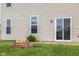 The home features a backyard with a fire pit, a small garden and access to a patio at 2502 Creekland Dr, Columbus, IN 47201