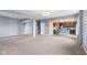 Finished basement with open layout connecting living space to kitchen area at 2502 Creekland Dr, Columbus, IN 47201