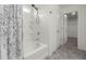 Bathroom features a shower-tub combination with white tile surround and a walk-in closet at 2502 Creekland Dr, Columbus, IN 47201