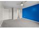 Bedroom featuring new carpet, a walk-in closet, and modern ceiling fan at 2502 Creekland Dr, Columbus, IN 47201
