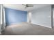 Spacious bedroom with neutral walls, modern ceiling fan, and plush carpeting at 2502 Creekland Dr, Columbus, IN 47201