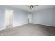 Large bedroom with new carpet, a ceiling fan, and a spacious closet at 2502 Creekland Dr, Columbus, IN 47201