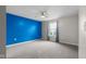 A spacious bedroom is freshly painted with a ceiling fan and a window at 2502 Creekland Dr, Columbus, IN 47201