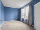 Cozy bedroom features a soft carpet, fresh paint, and great natural light at 2502 Creekland Dr, Columbus, IN 47201