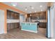 Gourmet kitchen boasts custom cabinets, center island, and stainless steel appliances at 2502 Creekland Dr, Columbus, IN 47201