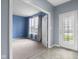 Bright and airy living room features fresh paint and modern flooring at 2502 Creekland Dr, Columbus, IN 47201