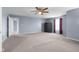 Spacious main bedroom features neutral carpeting and a ceiling fan at 2502 Creekland Dr, Columbus, IN 47201
