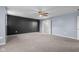 Spacious main bedroom features neutral carpeting and a bathroom ensuite at 2502 Creekland Dr, Columbus, IN 47201