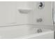 Shower with chrome hardware, tub, and white surround at 2502 Creekland Dr, Columbus, IN 47201