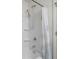 Clean white shower with a shower head and built-in shelving at 2502 Creekland Dr, Columbus, IN 47201
