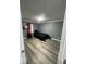 Simple bedroom with wood floors and a comfortable bed, flooded with natural light at 3041 S Rybolt Ave, Indianapolis, IN 46241