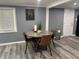 Dining area featuring a round wood table with decor and seating for four at 3041 S Rybolt Ave, Indianapolis, IN 46241