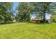 An expansive backyard with mature trees that is ideal for outdoor activities at 3105 E Banta Rd, Indianapolis, IN 46227