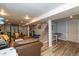 Finished basement with living area, home gym, and staircase access to upper floor at 3105 E Banta Rd, Indianapolis, IN 46227