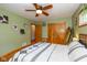 Bedroom boasts beautiful hardwood floors, a ceiling fan, and ample closet space at 3105 E Banta Rd, Indianapolis, IN 46227
