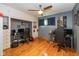 Spacious bedroom features built-in cabinets, hardwood floors, and plenty of space for work and play at 3105 E Banta Rd, Indianapolis, IN 46227