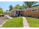 Charming brick home with inviting entrance, landscaped walkway, and well-kept lawn at 3105 E Banta Rd, Indianapolis, IN 46227