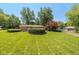 Spacious front yard features a brick ranch-style home with mature trees at 3105 E Banta Rd, Indianapolis, IN 46227