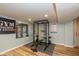 Well-equipped home gym in finished basement featuring weight rack and exercise equipment at 3105 E Banta Rd, Indianapolis, IN 46227