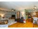 Cozy living room featuring a comfortable sitting area, ceiling fan, and a modern design at 3105 E Banta Rd, Indianapolis, IN 46227