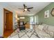 Open-concept living room with hardwood floors, comfortable seating, and natural light at 3105 E Banta Rd, Indianapolis, IN 46227