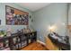 Home office with built-in shelving, hardwood floors, and a comfortable workspace at 3105 E Banta Rd, Indianapolis, IN 46227