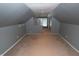 Finished attic with sloped ceilings, neutral paint, and carpeting, ready for many uses at 3602 N Colorado Ave, Indianapolis, IN 46218