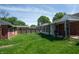 Backyard with a well-maintained lawn, wooden privacy fence, and rear view of house at 3602 N Colorado Ave, Indianapolis, IN 46218