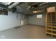 Unfinished basement featuring painted walls, exposed pipes, and wooden stairs, awaits your creative design at 3602 N Colorado Ave, Indianapolis, IN 46218