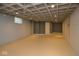Unfinished basement space with painted block walls and ceilings offers potential for customization at 3602 N Colorado Ave, Indianapolis, IN 46218