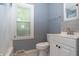 Bathroom with tile flooring, vanity, toilet, and bathtub with tiled walls at 3602 N Colorado Ave, Indianapolis, IN 46218