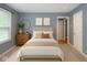 Inviting blue bedroom with a comfortable bed, dresser, and stylish decor at 3602 N Colorado Ave, Indianapolis, IN 46218