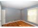 Bedroom with hardwood flooring, neutral walls, and natural light from window at 3602 N Colorado Ave, Indianapolis, IN 46218