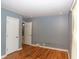 Bedroom featuring hardwood floors, modern trim, and neutral walls at 3602 N Colorado Ave, Indianapolis, IN 46218