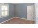 Bedroom featuring a window and neutral colored walls and carpet at 3602 N Colorado Ave, Indianapolis, IN 46218