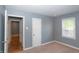 Bedroom featuring a window and neutral colored walls and carpet at 3602 N Colorado Ave, Indianapolis, IN 46218