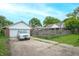Driveway with detached garage and a silver SUV parked, showcasing backyard at 3602 N Colorado Ave, Indianapolis, IN 46218