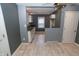 Updated kitchen features white cabinets and dark counter tops and gray-painted walls at 3602 N Colorado Ave, Indianapolis, IN 46218