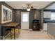 Open-concept kitchen dining area featuring an island with bar stools and modern appliances at 3602 N Colorado Ave, Indianapolis, IN 46218