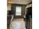 Modern kitchen features stainless steel appliances, dark countertops, and sleek cabinetry at 3602 N Colorado Ave, Indianapolis, IN 46218