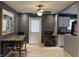 Open-concept kitchen with modern lighting, tile floors, and bar-style seating at 3602 N Colorado Ave, Indianapolis, IN 46218