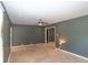 Living room featuring a ceiling fan, neutral walls, and plush carpeting at 3602 N Colorado Ave, Indianapolis, IN 46218