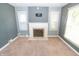 Living room featuring a fireplace, neutral walls, and plush carpeting at 3602 N Colorado Ave, Indianapolis, IN 46218