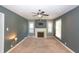 Living room featuring a fireplace, neutral walls, and plush carpeting at 3602 N Colorado Ave, Indianapolis, IN 46218
