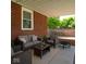 Relaxing covered patio with comfortable seating and an outdoor fire pit for cozy gatherings at 3602 N Colorado Ave, Indianapolis, IN 46218