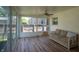 Enclosed sun room featuring wood-look floors and natural light at 3602 N Colorado Ave, Indianapolis, IN 46218